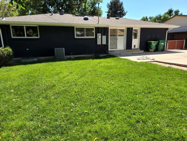 Back of house and fenced yard - 3485 W Powers Pl