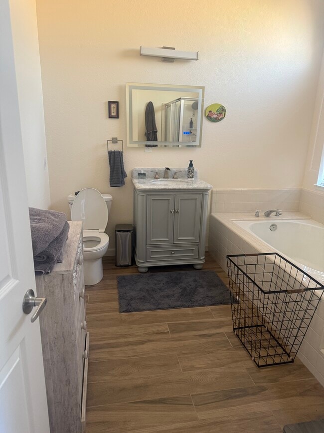 Roomy bathroom with a tub. - 12376 Tioga Ct Apartment Unit Tioga Bella