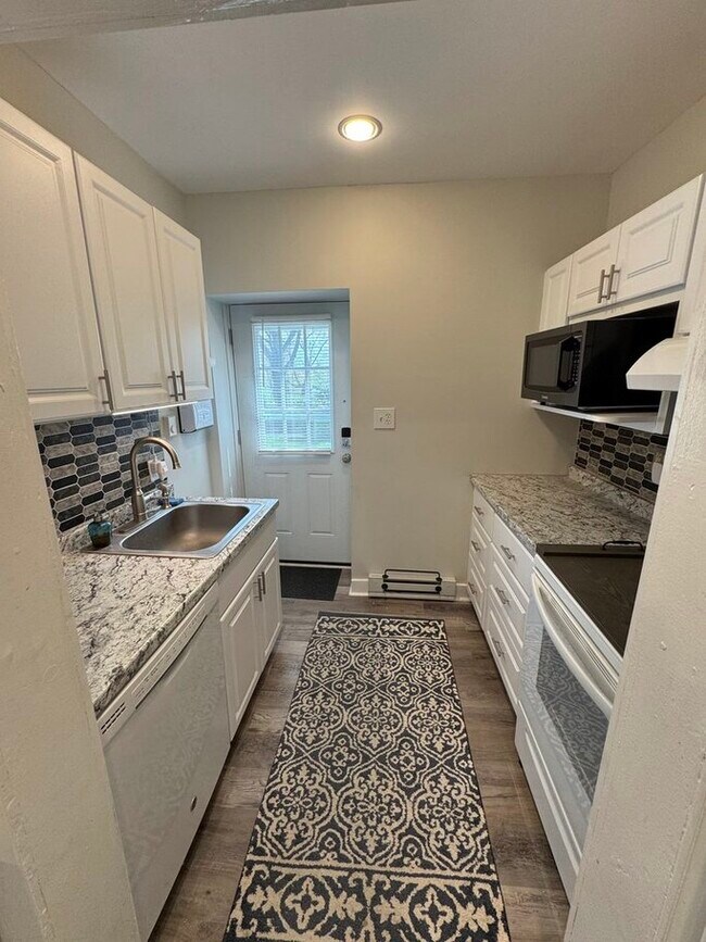 Kitchen with DW and Microwave - 130 E Wayne Ave Unit 1