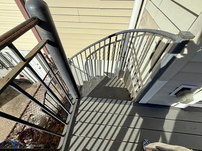 Spiral stairs from deck to yard. - 388 Princeton Ave