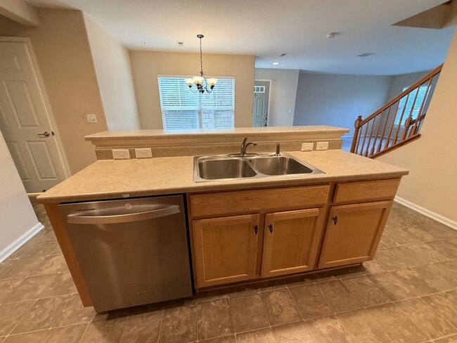 Photo - Bright Open-Concept Condo with 1-Car Garage in Prime Commuter Location