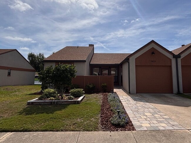 Photo - 2 Bed 2 Bath Luxury Waterfront Townhome with Screened Lanai & Garage!
