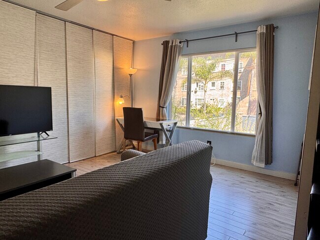 New couch cover (still a pull out sofa bed) - photo taken May 21 2025. More new photos soon! - 1045 1/2 Sanborn Ave