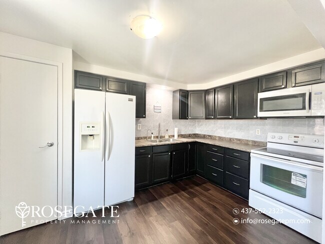 Photo - Spacious 3-Bedroom Home with 3 Parking Spaces & Backyard in Cambridge