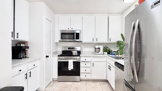 Photo - Fantastic 4 bedroom home with a 1 car garage and driveway space for additional car! Backyard and ...