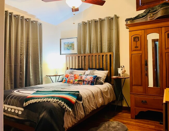 Private Bedroom with block out curtains, and wood blinds. - 905 Prospect Ave