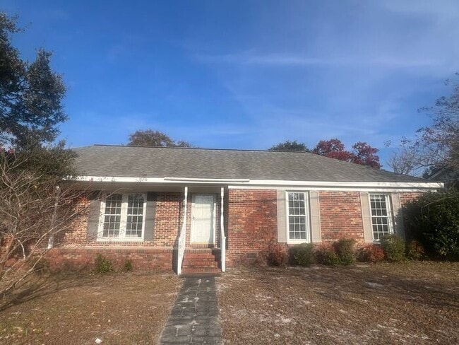 Photo - Brick one level home, Live Oak Tree, 3-4 bedrooms, fenced yard, deck.