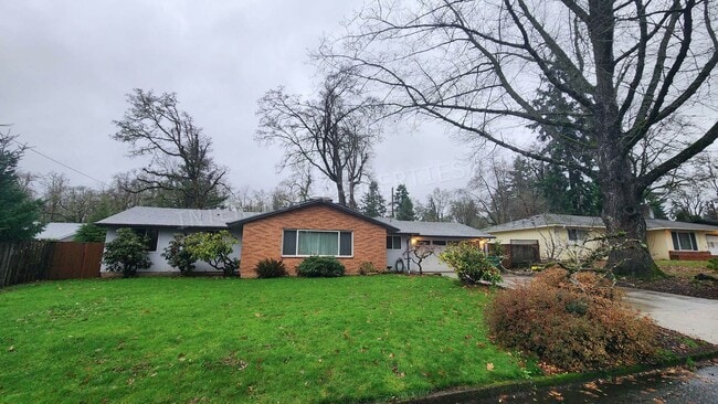 Photo - 3 bd 2ba Ranch Style Home with Fenced Yard, W/D in Unit, Fireplaces & 2 Car Garage!