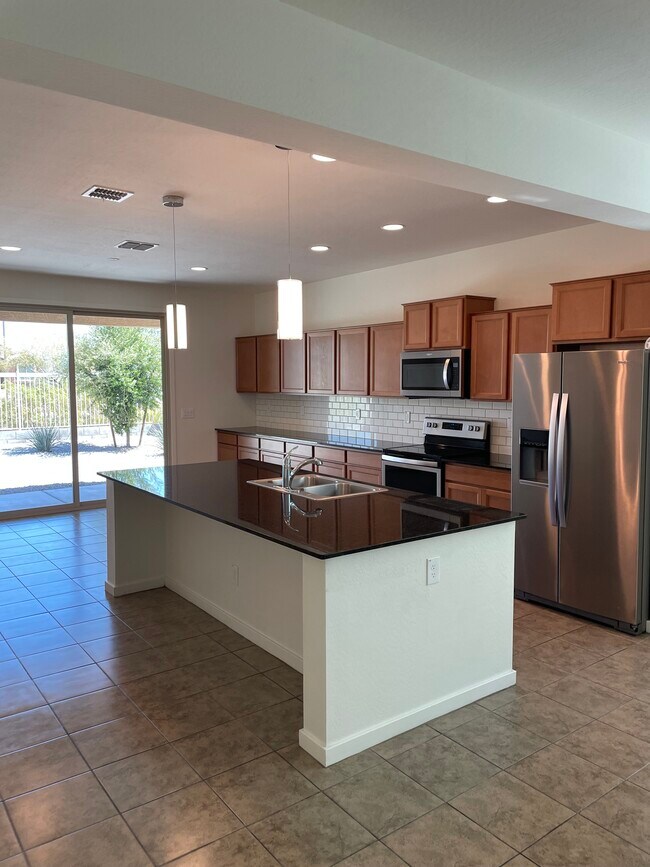 Kitchen with plenty of cabinets & stainless appliances. - 2185 S 237th Dr