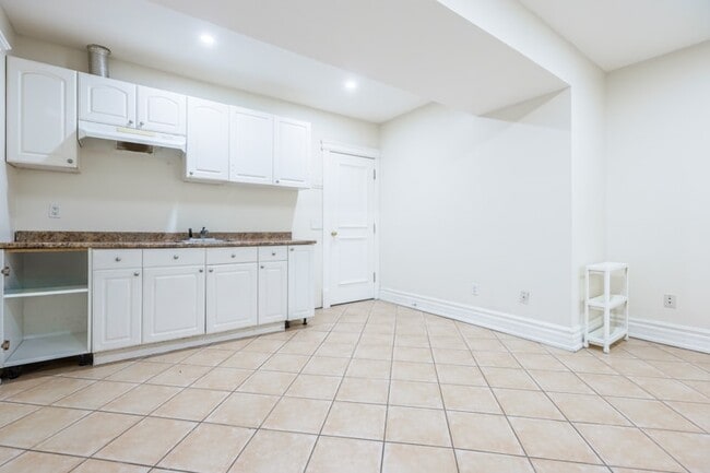 Building Photo - Bright, Beatutiful & Look Out Basement Apt.