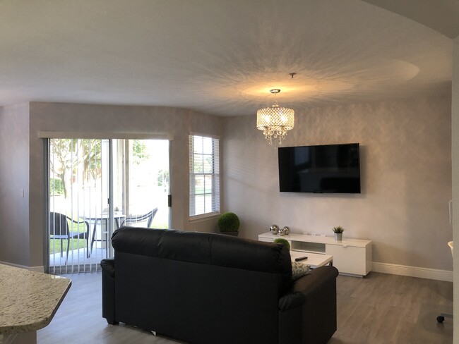 Living Room fully furnished with modern decor! - 7350 Westpointe Blvd Unit 212 Rental