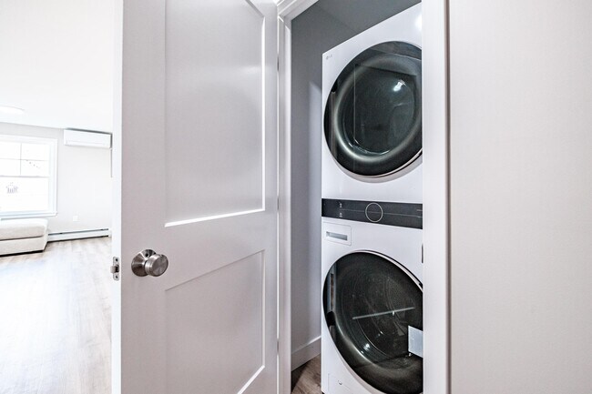Enjoy the convenience of a full-size washer and dryer included in every apartment, making laundry day simple and hassle-free. - Windham Village Apartments