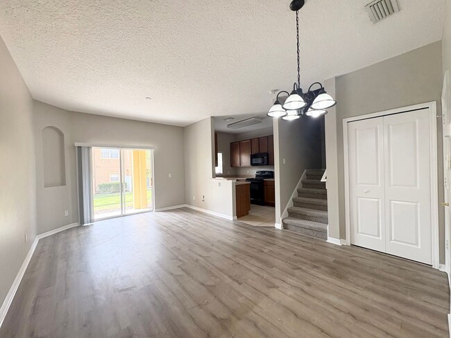 Building Photo - Gated 3B/2.5B Sanford Townhome ~ Fresh paint! ~ New flooring!