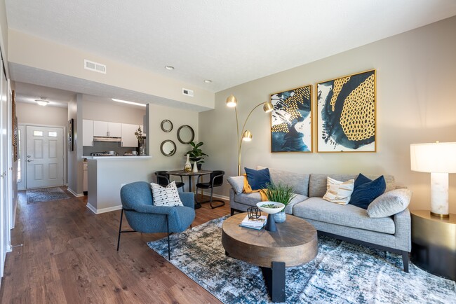 Newly Renovated Living Room with Gorgeous Hardwood-Style Flooring - BriceGrove Park Apartments