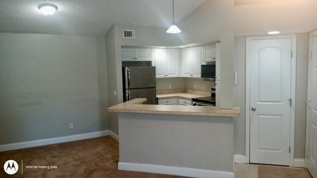 Photo - Spacious third floor unit located in the gated community of Venetian place