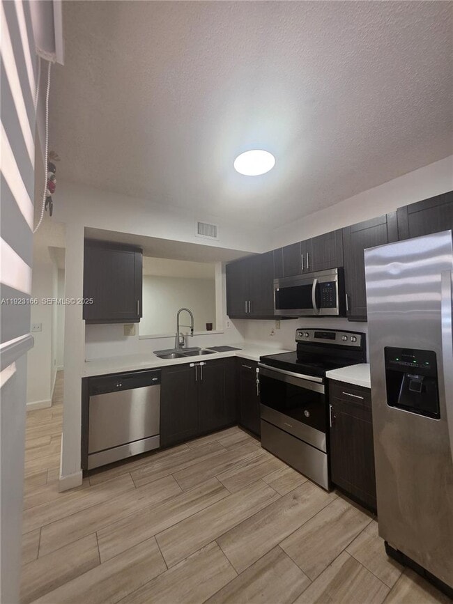 Building Photo - 15711 SW 137th Ave Unit 101