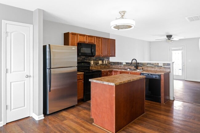 Photo - pdated 2BR/2.5BA Townhome with Private Fenced Patio