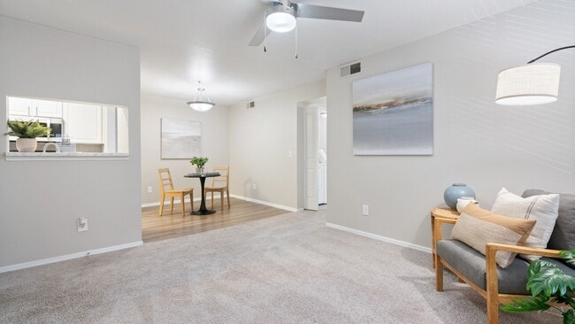 Enjoy the seamless flow of this open-concept living and dining area, perfect for relaxing or entertaining guests.