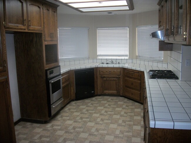 Photo - Coming Soon: Spacious Renovated 3 Bedroom Rosedale Home with Pool, Dual Fireplaces & Covered Patio