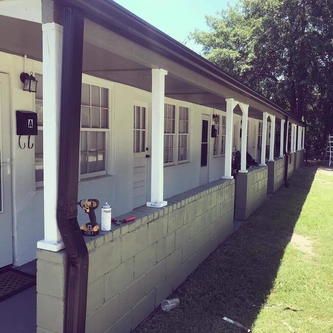 Covered porch Area in front of units perfect for enjoying a cup of tea in the morning.