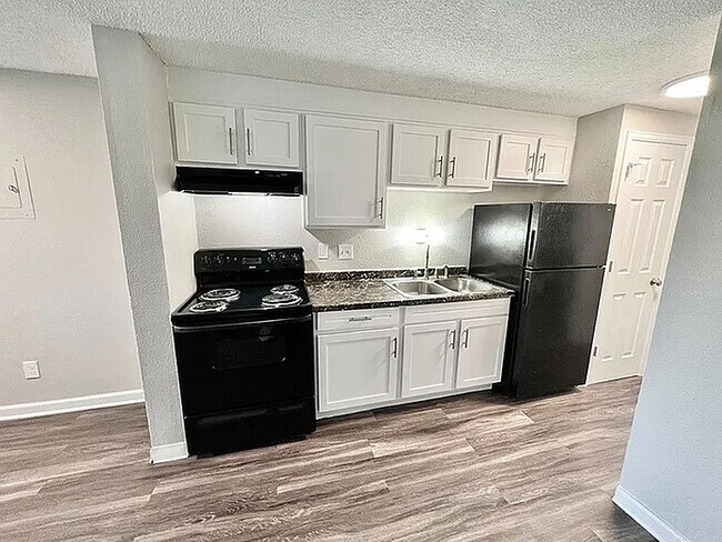 Experience efficient design with this cozy modern kitchen featuring sleek finishes. - Monte Vista