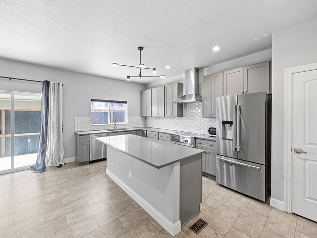 Photo - 4-Bedroom Townhome with Finished Basement, Garage & Private Outdoor Space