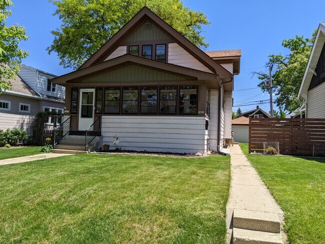 Sidewalk leads to back patio and entrance to upper unit - 1612 S 77th St Unidad Upper