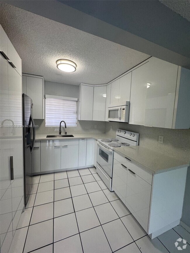 Building Photo - 7965 W 30th Ct Unit 210 Rental