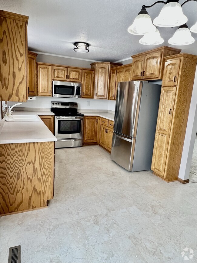 Stainless Steel Appliances in updated kitchen - 1428 12th Ave N Rental