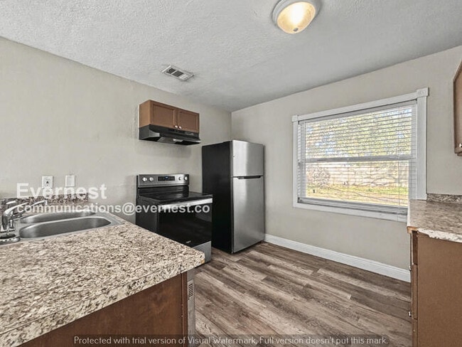 Photo - 4 Bed, 2 Bath Home with Off-Street Parking / Pet-Friendly / Available Now!