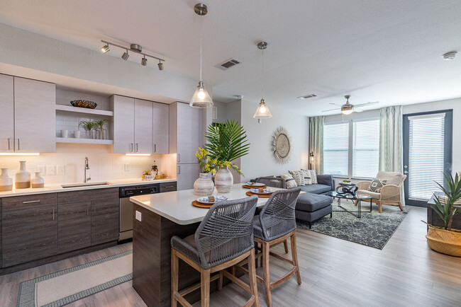 At Irving Place, each apartment home features an inviting Kitchen with luxury features. - Irving Place North Rocky Point Apartments