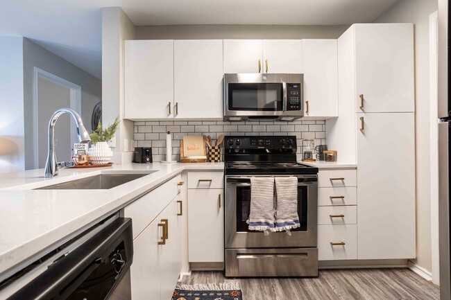 University-Trails-College-Station-Off-Campus-Apartments-Near-Texas-A&M-Spacious-Kitchen-Stainless-Steel-Appliances-Quartz-Countertops - University Trails