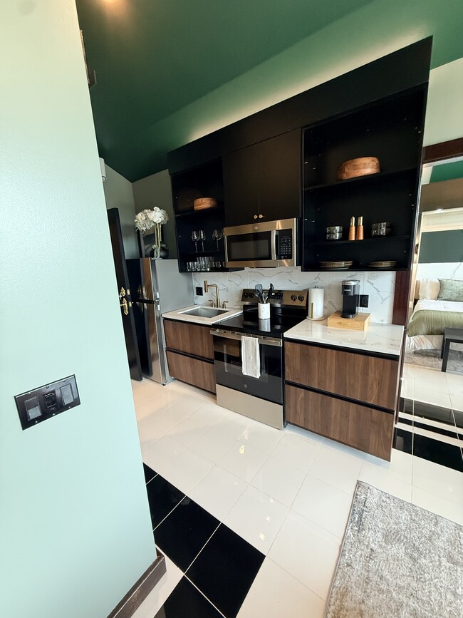 Cocina de la suite ejecutiva para estancias prolongadas - Villas on Turtle Creek