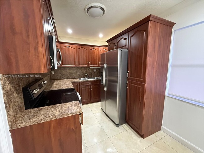 Building Photo - 1560 W 46th St Unit 115 Rental