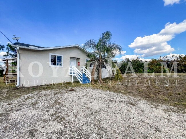 Photo - 4 Bedrooms, 2 Bathrooms & a Huge Backyard — Spacious Lehigh Acres Home with Pet-Friendly Living o...