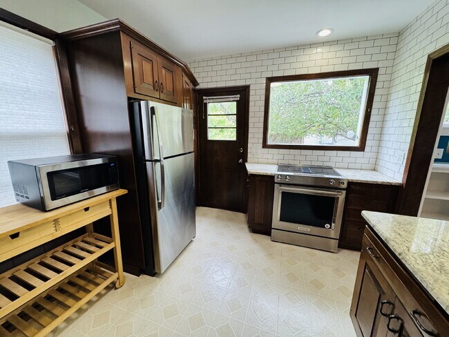 Photo - Charming 3-Bedroom Oasis with Elegant Touches & Finished Basement on Washburn Ave!