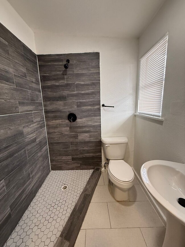 Photo - **50% Off First Month's Rent!** Renovated 4 Bedroom Home with Updated Floors & Modern Kitchen