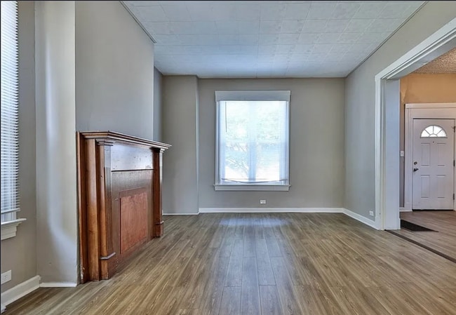 Photo - Bright 4-Bed Home with Fenced Yard, Central HVAC, and 3 Finished Levels