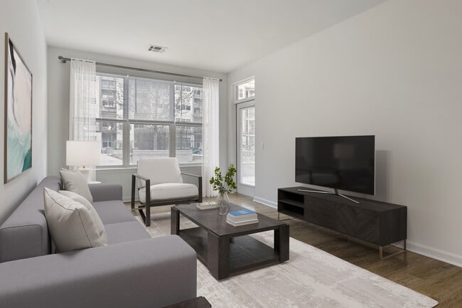 Renovated Package I living room with hard surface flooring