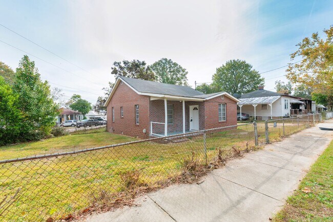 Photo - Brick home with a fenced-in yard! Section ...