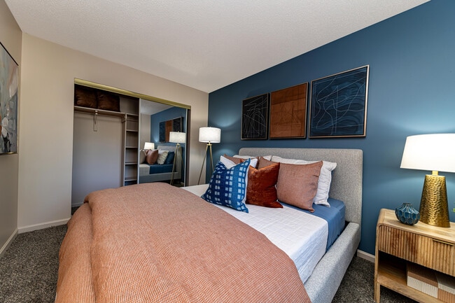 Cozy bedroom with carpet and generous closet space
