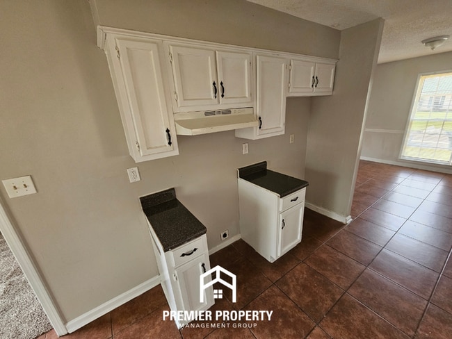 Photo - Quiet Cove Living in 38115 | 3BR/2BA with Brick Fireplace & Fenced Yard