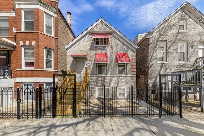 Building Photo - 2409 S Spaulding Ave Unit 1