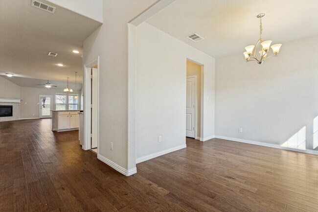 "Spacious 5-Bedroom Oasis with Granite Elegance and Hardwood Charm in Fort Worth!"