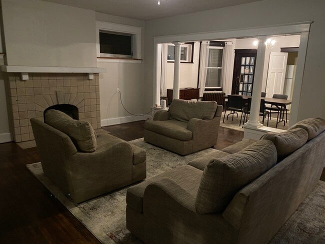 large dinning room, living room, comes with rug and couches, table and chairs. - 339-2 Probasco St Unit 2nd Floor