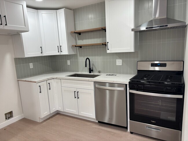 Kitchen with new appliances - 11940 Weddington St Unit 19