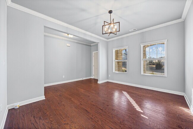 Photo - Classic finishes paired with an open, versatile layout!