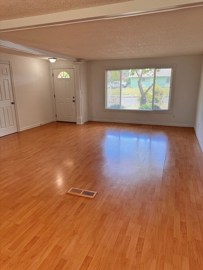 Photo - Single Level Home w/HUGE fenced yard, AC, W/D, Garage & More!