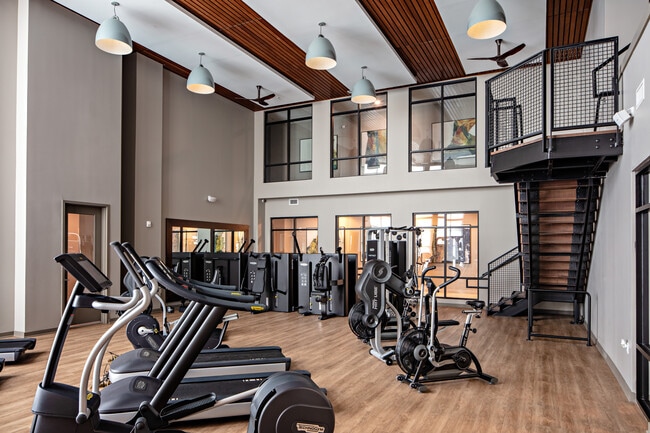 Two-level fitness center with cardio and strength equipment