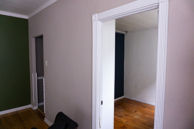 View into second bedroom and entrance to kitchen from dining/living space, facing north - 622 End Ct Unit 622 End Ct